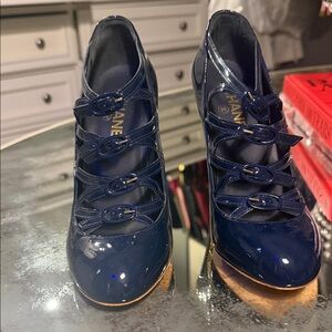 CHANEL Patent Leather Navy Heels with Buckle Design and Gold Heel